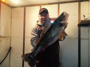 Tommy with 28 inch walleye