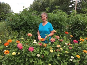 Diane behinds flowers