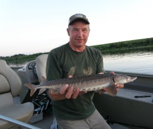 Jeff with small sturgeon